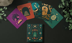 Tarot of the Velvet Moon - Tarot of the Velvet Moon: Magnetic box with gold holographic foil stamping alongside sample cards.