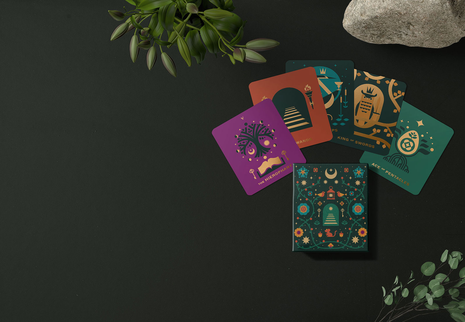 A folk art inspired miniature tarot deck printed in bold colors and gold metallic ink for a subtle sheen. Adorned with holographic gold edges.