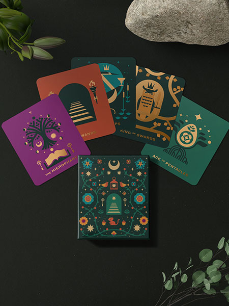 A folk art inspired tarot deck with metallic ink printing