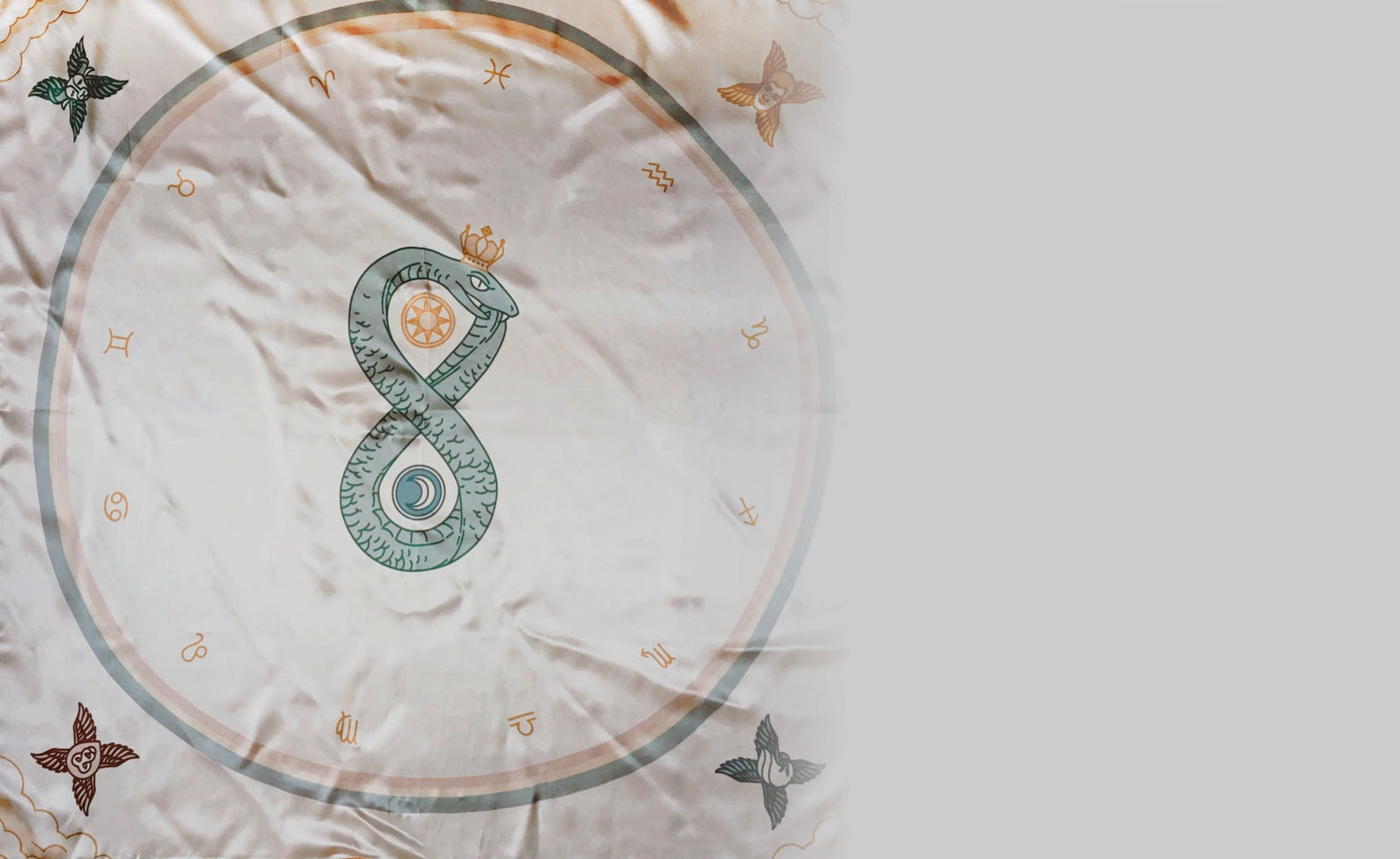 Tarot cloth companion for the Arcana Iris Sacra and Claves Astrologicae. Featuring coiled serpent, dualities, elements, and zodiac signs for intuitive placement of tarot cards.