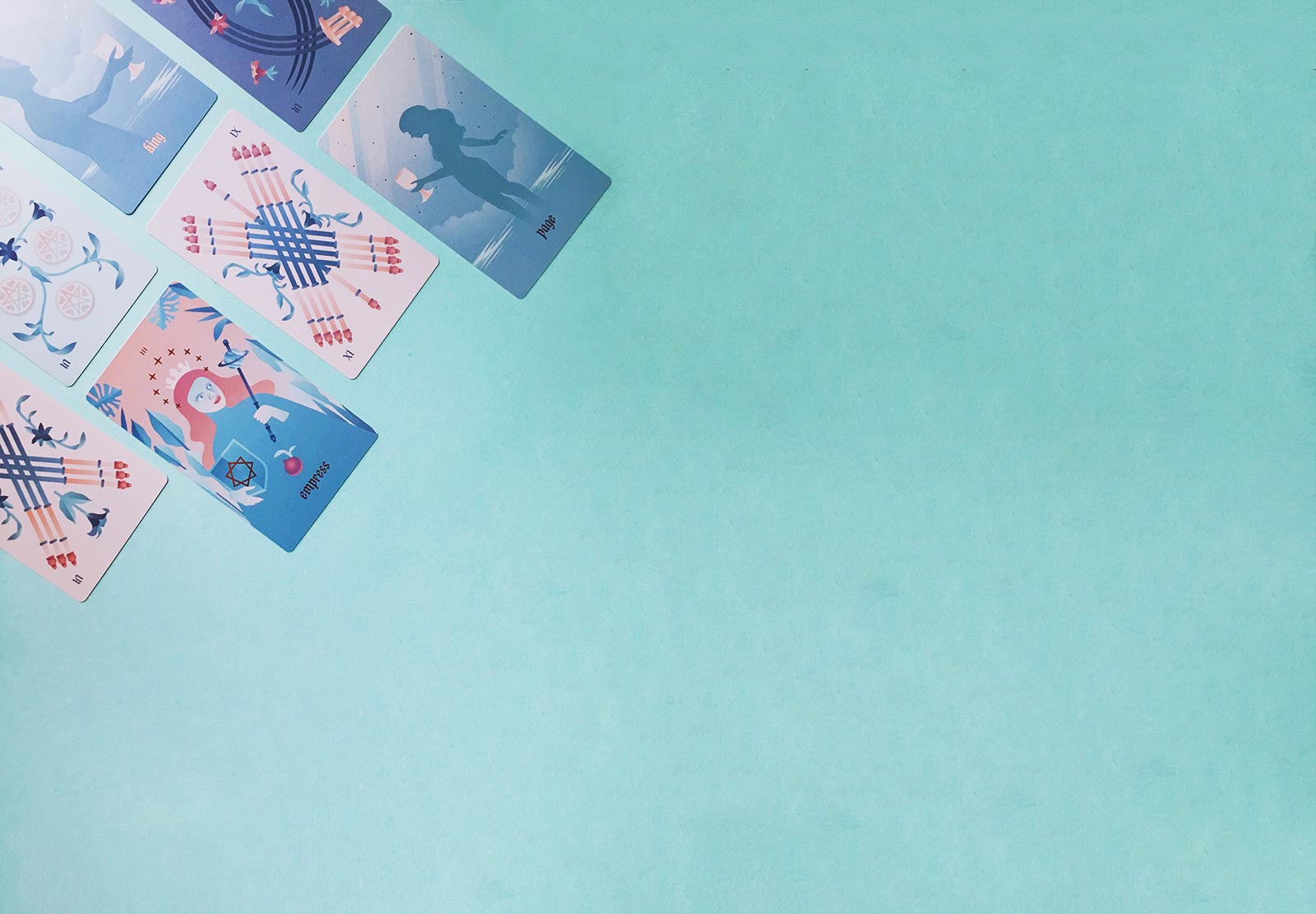 A modern Marseille tarot deck featuring rose gold detailing, rose gold edges, and bright, gentle, colorful full-bleed illustrations. Companion to the Seventh Sphere Lenormand deck.